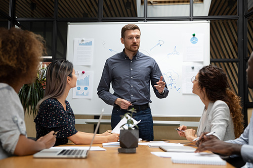 Man leading business meeting